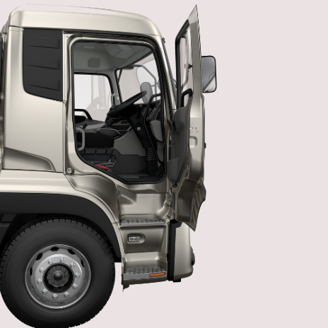 Silver truck cab with open driver's door, showing interior and steering wheel.