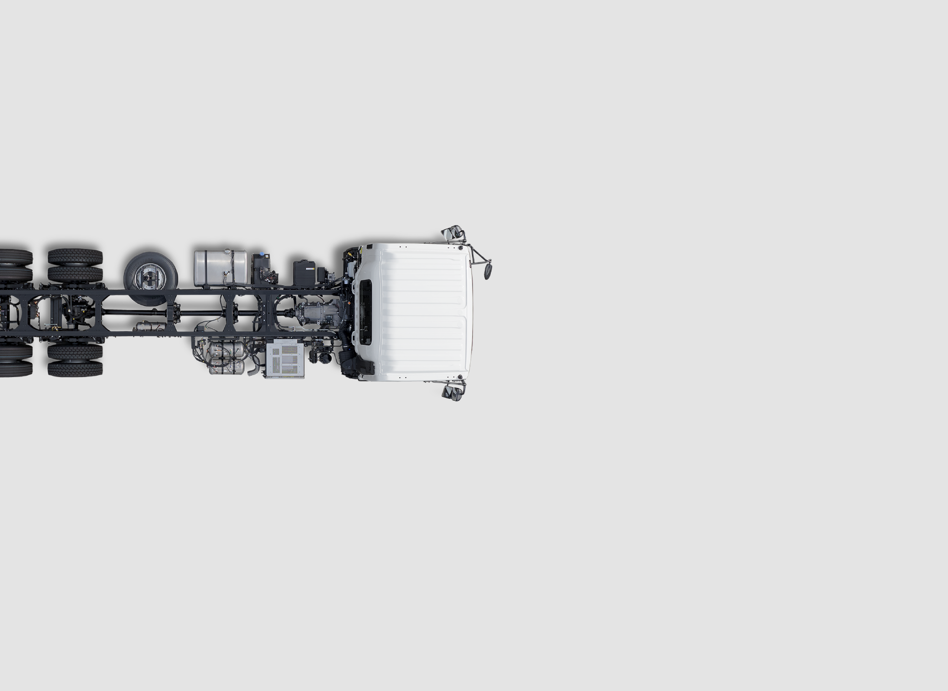 White truck chassis viewed from above on a plain light gray background.